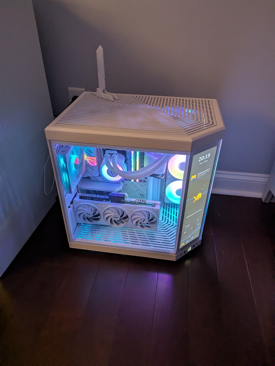 HYTE Y70 Touch case with liquid cooling, white RTX 5080, and RGB memory glowing