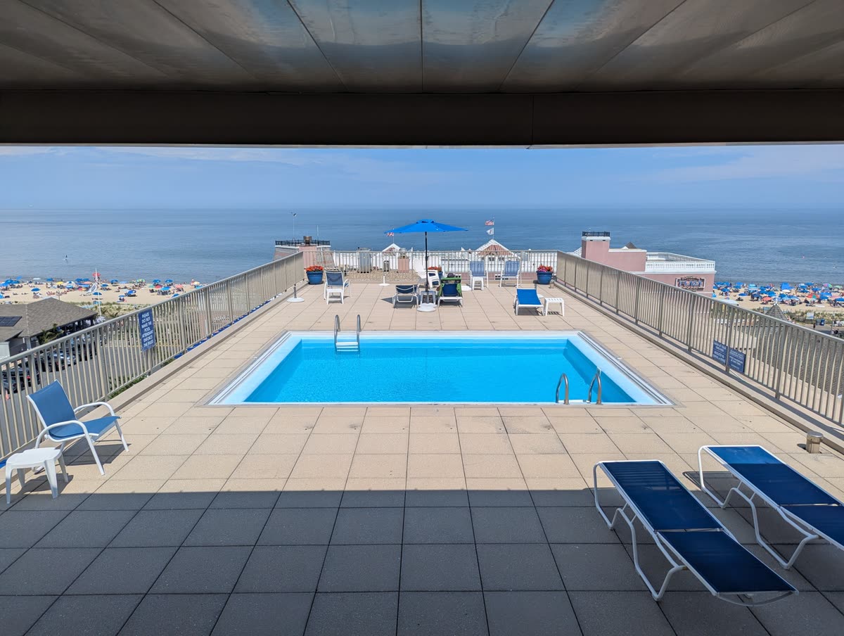 Rooftop pool deck of Patrician Towers overlooking the ocean and Rehoboth Beach boardwalk